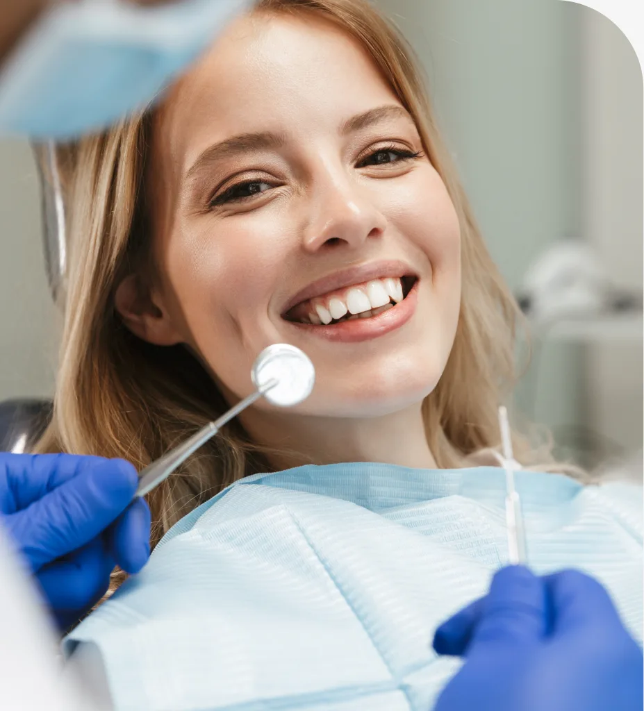 Woman smiling after cosmetic dentistry treatment